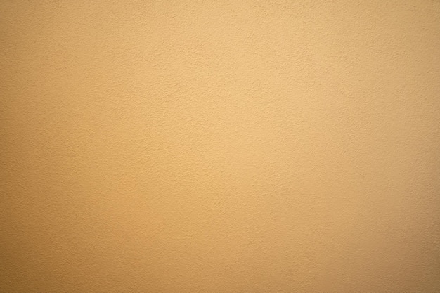 Пустая бетонная стена желтого цвета для текстуры фона Новая поверхность выглядит грубой Обои