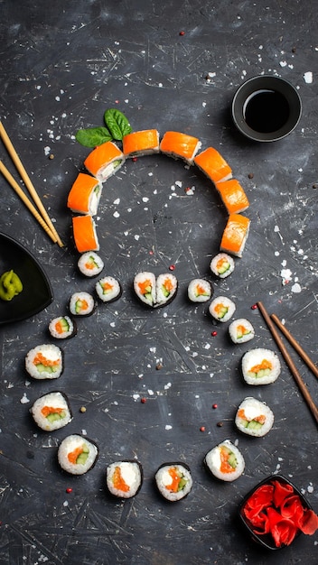 A blank for congratulations on March 8 The number 8 is made of sushi on a black background