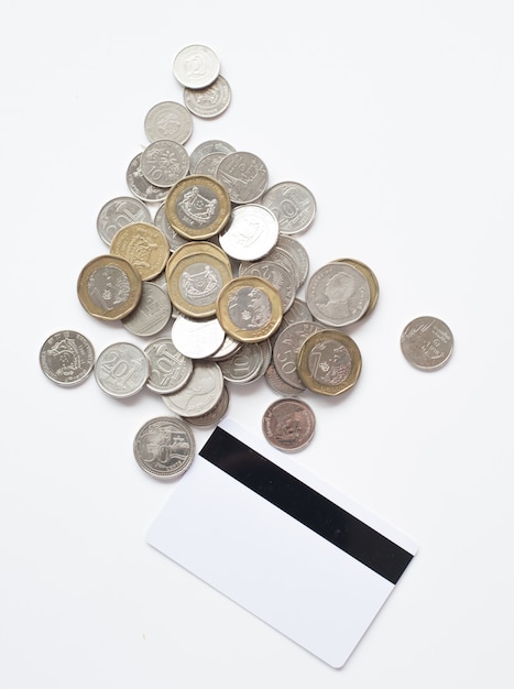 Blank credit card and coin on white background 