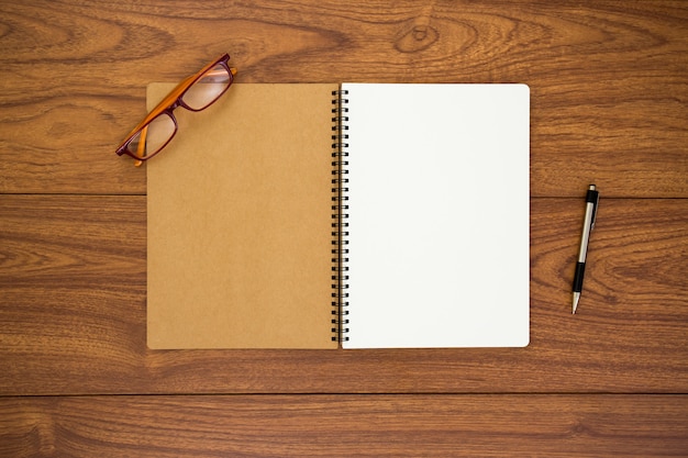 Blank diary on wood background