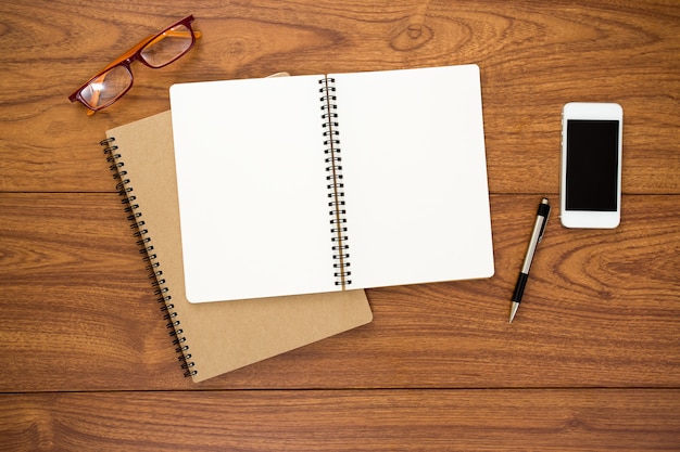 Blank diary on wood background