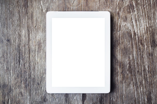 Blank digital tablet on a wooden table mock up