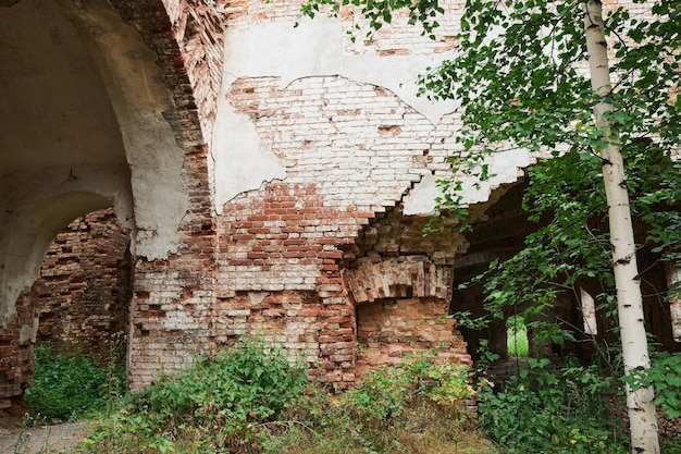 A blank doorway on a grungy decaying brick wall