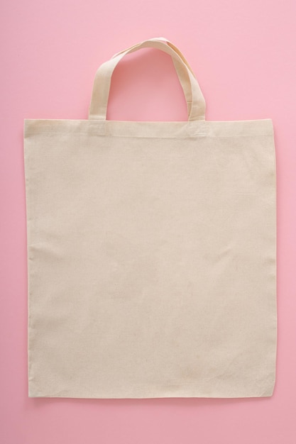 Photo blank eco friendly beige colour fashion canvas tote bag isolated on white background empty reusable bag for groceries clear shopping bag design template for mockup front view studio photography