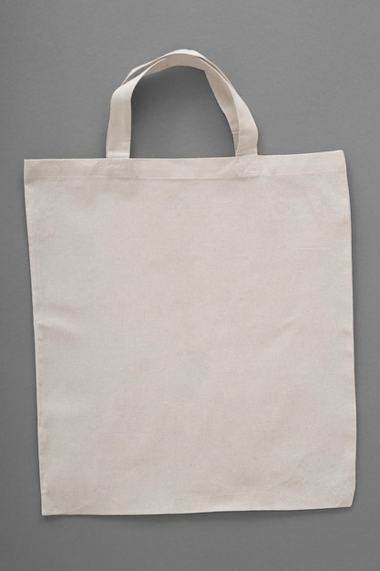 Foto vuoto eco friendly colore beige tela tote bag isolato su sfondo bianco vuoto riutilizzabile borsa per generi alimentari chiaro shopping bag modello di progettazione per mockup vista frontale fotografia in studio