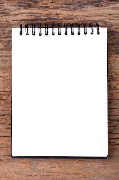 Blank empty notepad on wood background