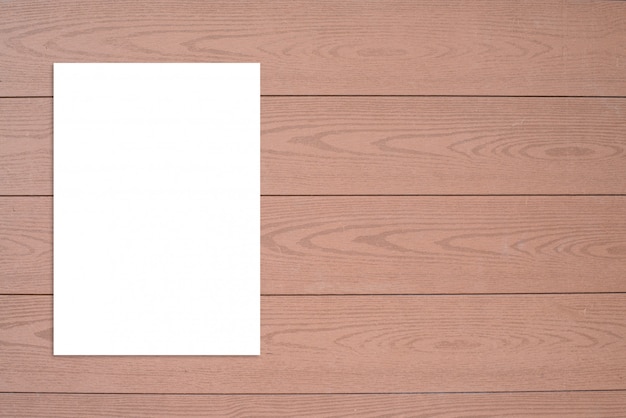 Blank folded paper poster hanging on wooden wall template mock up 