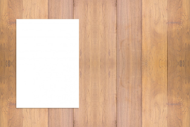 Photo blank folded paper poster hanging on wooden wall