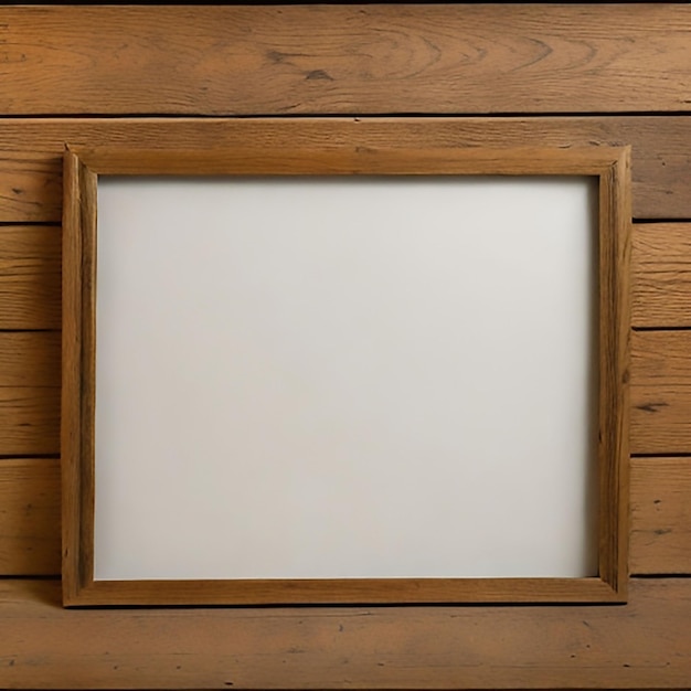 Blank frame on wooden wall