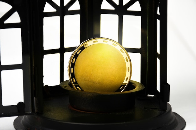 Blank gold coins in a metal pedestal with a black window on a white background