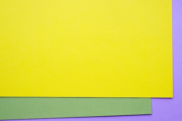 Blank green, purple and yellow paper texture background