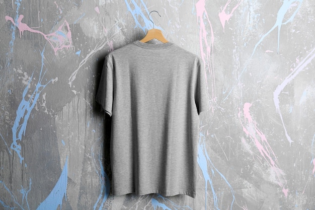 Blank grey tshirt on grunge background