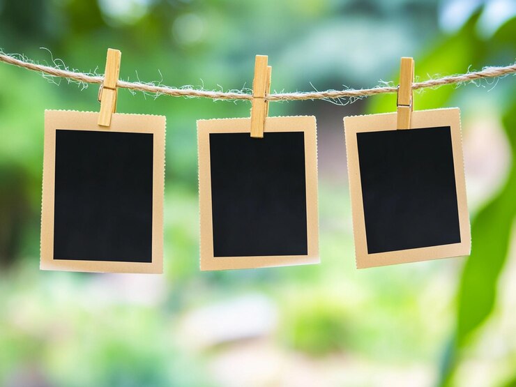 Photo blank instant photos hanging on clothesline