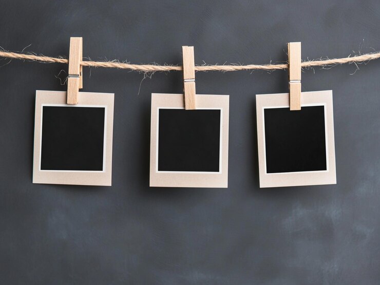 Photo blank instant photos hanging on clothesline