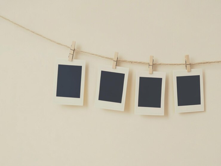 Photo blank instant photos hanging on clothesline