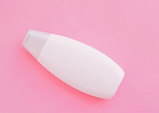 Blank label shampoo bottle or shower gel on pink background beauty product and body care cosmetics