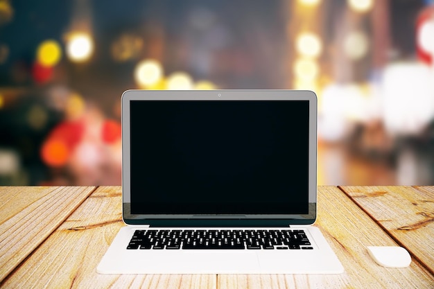 Blank laptop on bokeh background