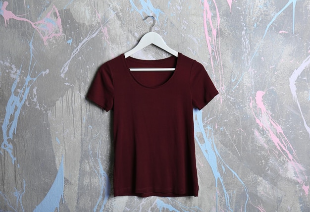 blank maroon tshirt on grunge background