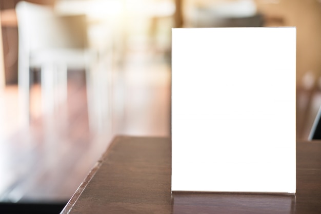 blank menu frame on table in coffee shop stand for your text of display