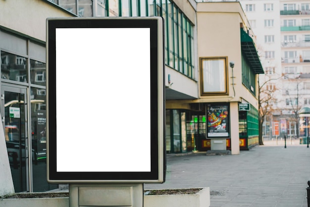 Photo blank mock up of vertical street poster billboard on city background advertising outdoor business city event ad