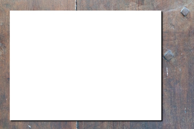 Blank mockup white paper sheet page on wooden desk plank background