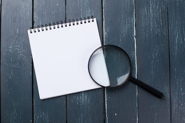 Blank note book on table, top view