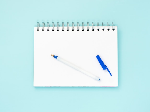 Blank note paper on blue background