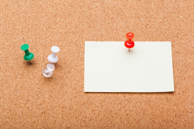 Photo blank note paper on a cork board