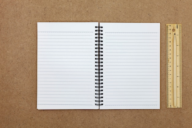 Blank Notebook on brown paper background