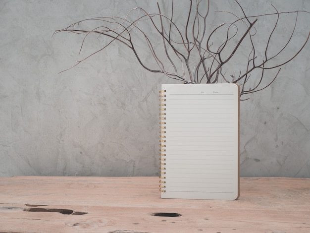 Blank notebook on teak wooden table