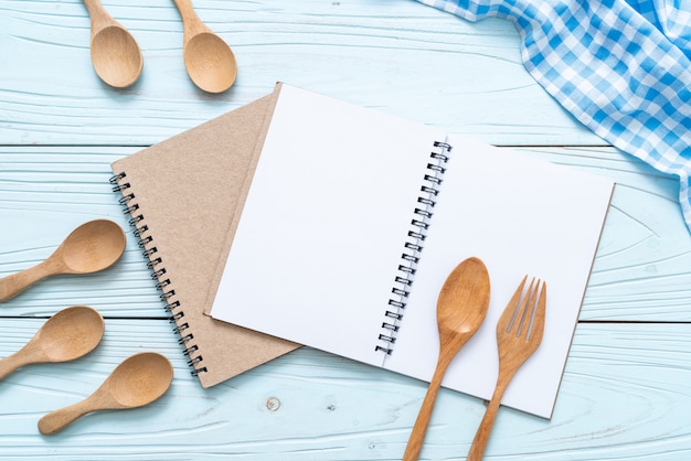 blank notebook for text note on wooden surface