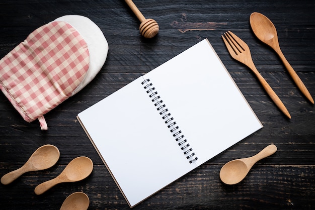 blank notebook for text note on wooden surface