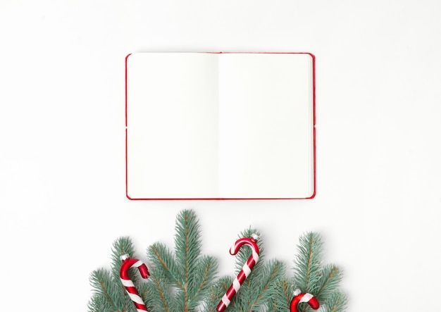 Blank notebook with Christmas decoration, top view