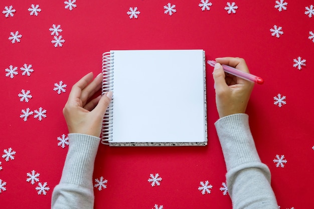 Blank notebook with female hands