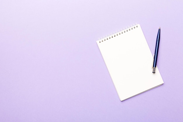 Blank notebook with pen on white background Back to school and education concept