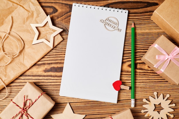 Blank notepad on background of christmas accessories