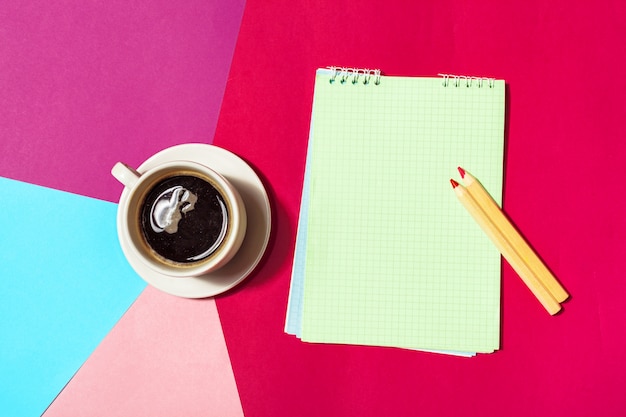 Blank notepad and coffee cup