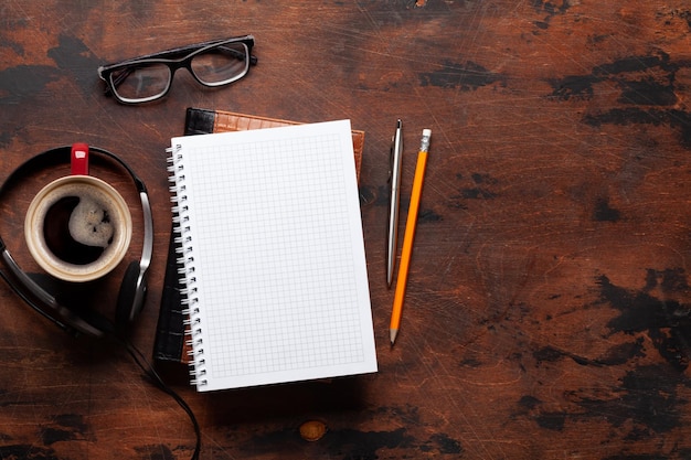 Blank notepad coffee and headset