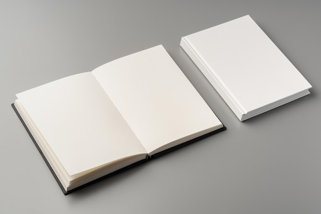 blank notepad on gray background studio shot