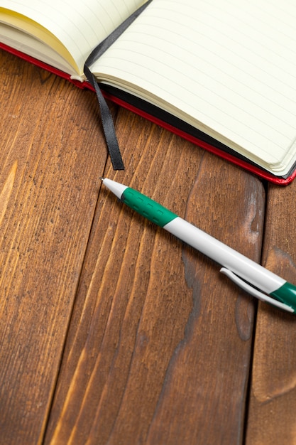 Blank notepad on office wooden table