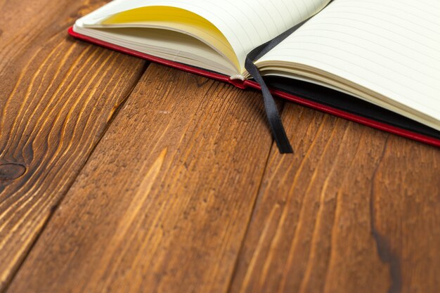 Blank notepad on office wooden table