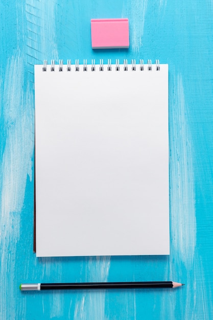 Blank notepad page with pencil