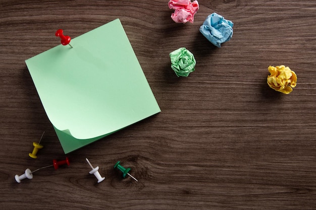 Blank notepad on wooden background