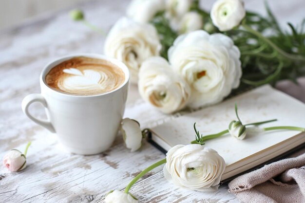 Blank open notebook on wooden rustic background with cup of coffee