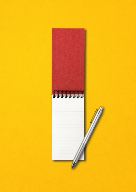 Blank open spiral notebook and pen mockup isolated on yellow