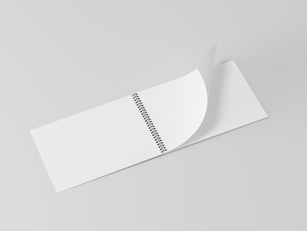Blank open spring notebook on the empty background notepad sheet