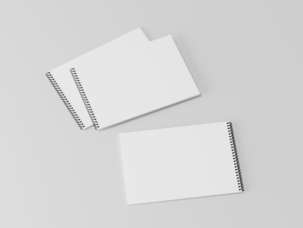 Blank open spring notebook on the empty background notepad sheet