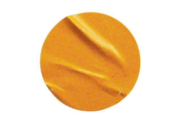 Blank orange round adhesive paper sticker label isolated on white background