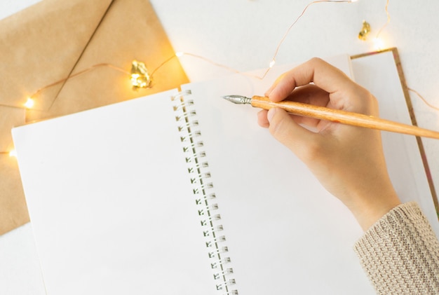 Blank page of open notebook and decor items 