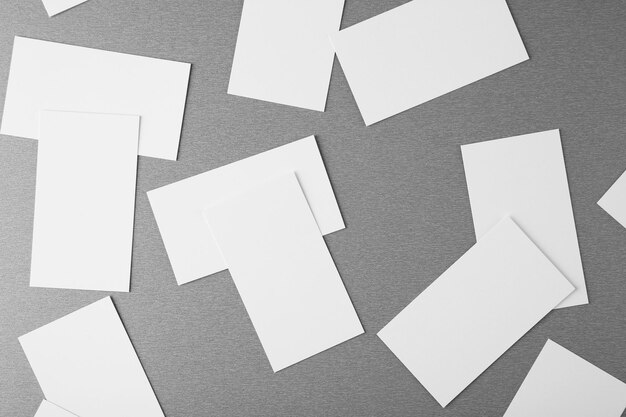 Blank paper cards for branding on grey background